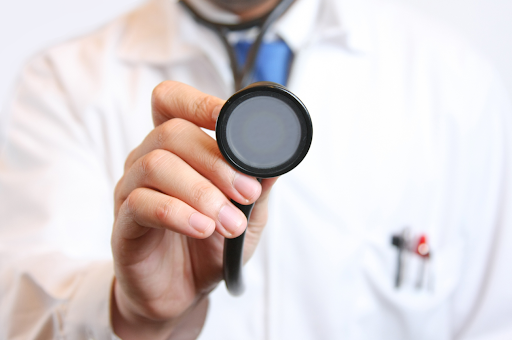 Doctor holding a stethoscope.