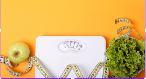 Scale with apple, measuring tape, and bowl of lettuce symbolizing weight loss and nutrition for COPD health.