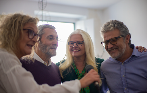 Group of COPD patients singing together during a therapy session.