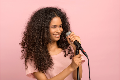 Young patient with respiratory condition singing during therapy.