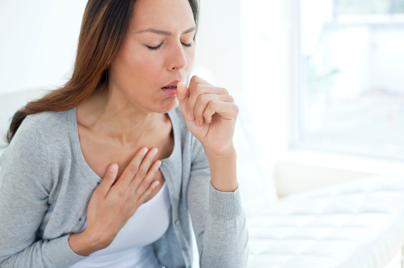 Woman experiencing shortness of breath, a common symptom of COPD.
