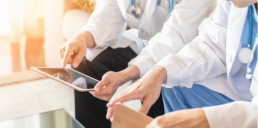 Healthcare professionals reviewing patient records on a tablet for better COPD management