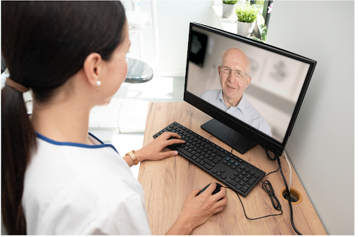Health professional guiding elderly COPD patient through digital rehabilitation online