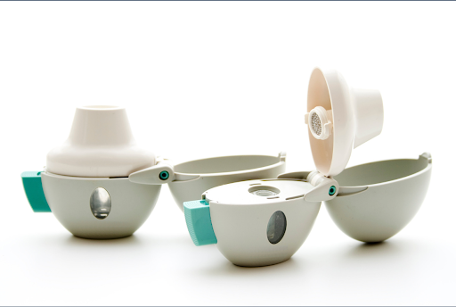 Dry powder inhalers on a neutral background, used for respiratory therapy and COPD treatment.