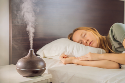An ultrasonic nebulizer emitting mist beside a sleeping woman, used for medication administration in COPD treatment.