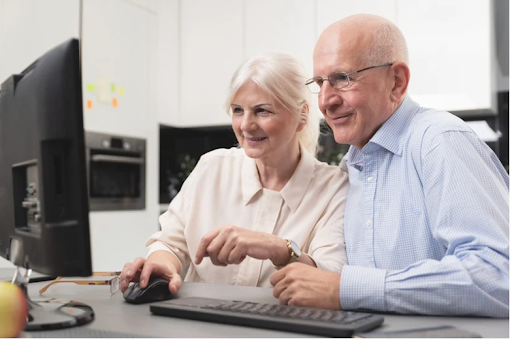 An elderly couple learning about COPD self-management on a computer, highlighting the importance of knowledge.